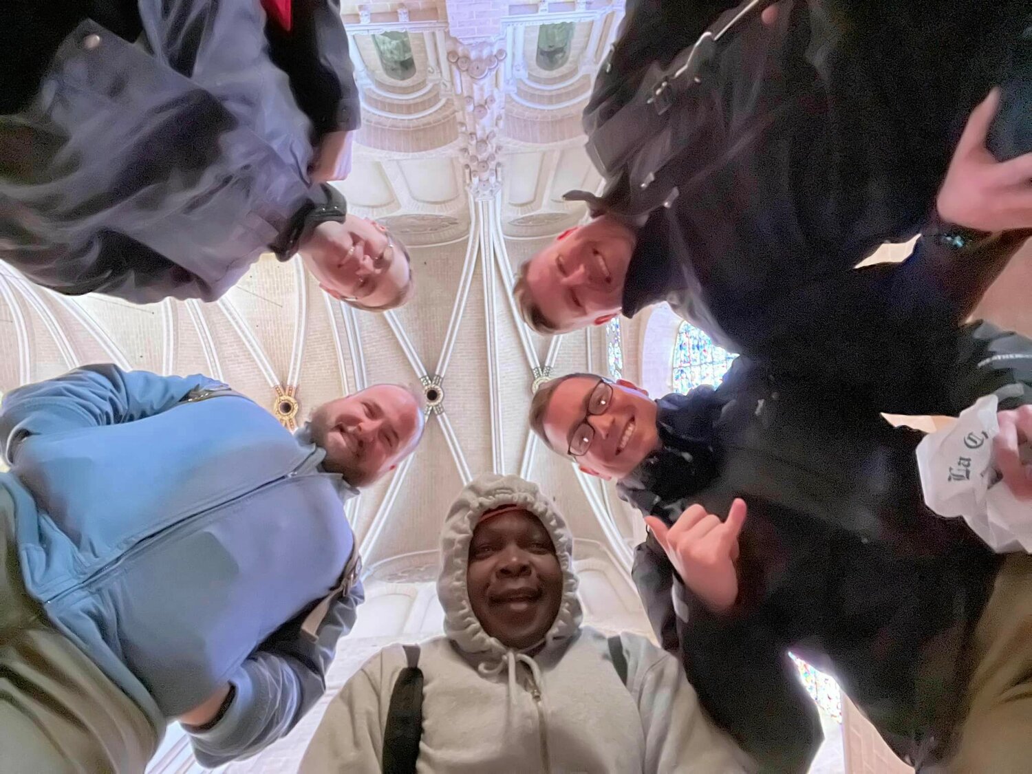 Father Stephen Jones, Father Nicholas Reid, Father Boniface Kasiita Nzabonimpa, Father Paul Clark and Father Dylan Schrader gather for a photo in the Cathedral of Our Lady (Notre Dame) in Chartres, France.